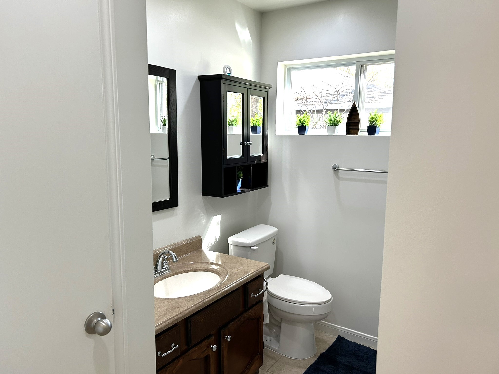 25414 Cottage Hill Lane Spring, TX 77373 - Photo 24 of 50 a bathroom with a toilet sink and mirror