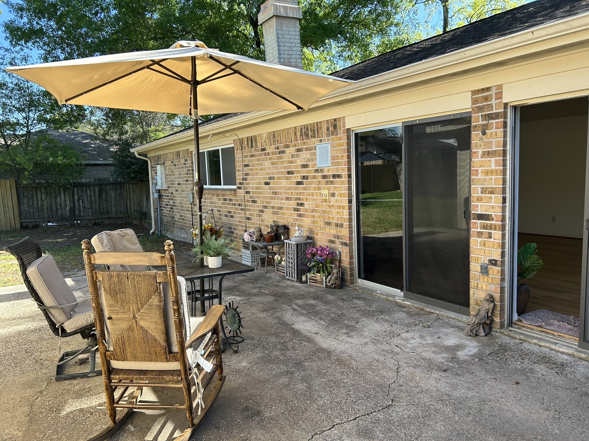 25414 Cottage Hill Lane Spring, TX 77373 - Photo 40 of 50 a view of a patio with table and chairs under an umbrella