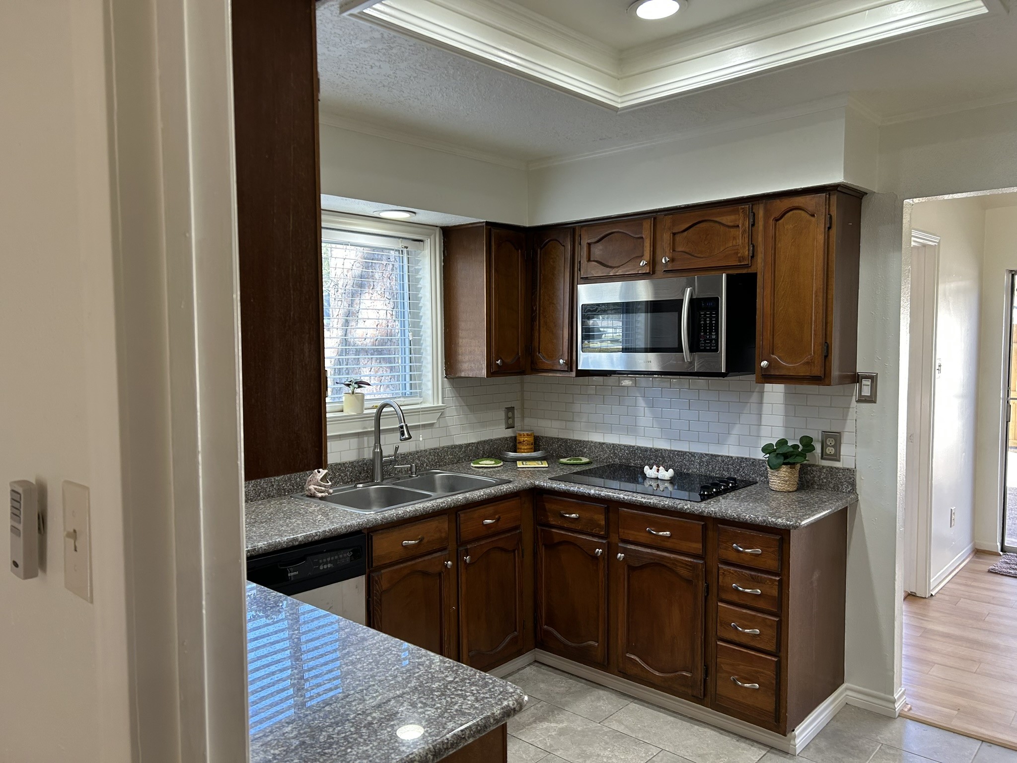 25414 Cottage Hill Lane Spring, TX 77373 - Photo 9 of 50 a kitchen with stainless steel appliances granite countertop a sink stove and microwave