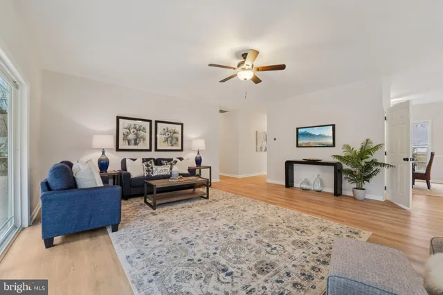 a dining room with furniture and a mirror