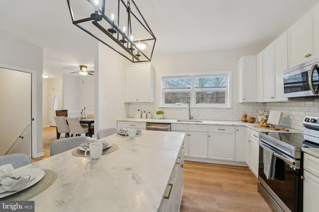 a view of a kitchen from a dining room