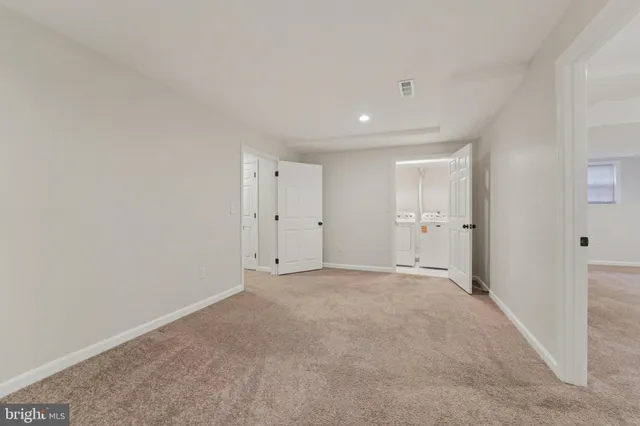 a bathroom with a shower and a sink