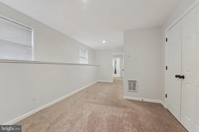 an aerial view of a house with yard