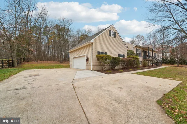 a view of a livingroom with wooden floor and a window