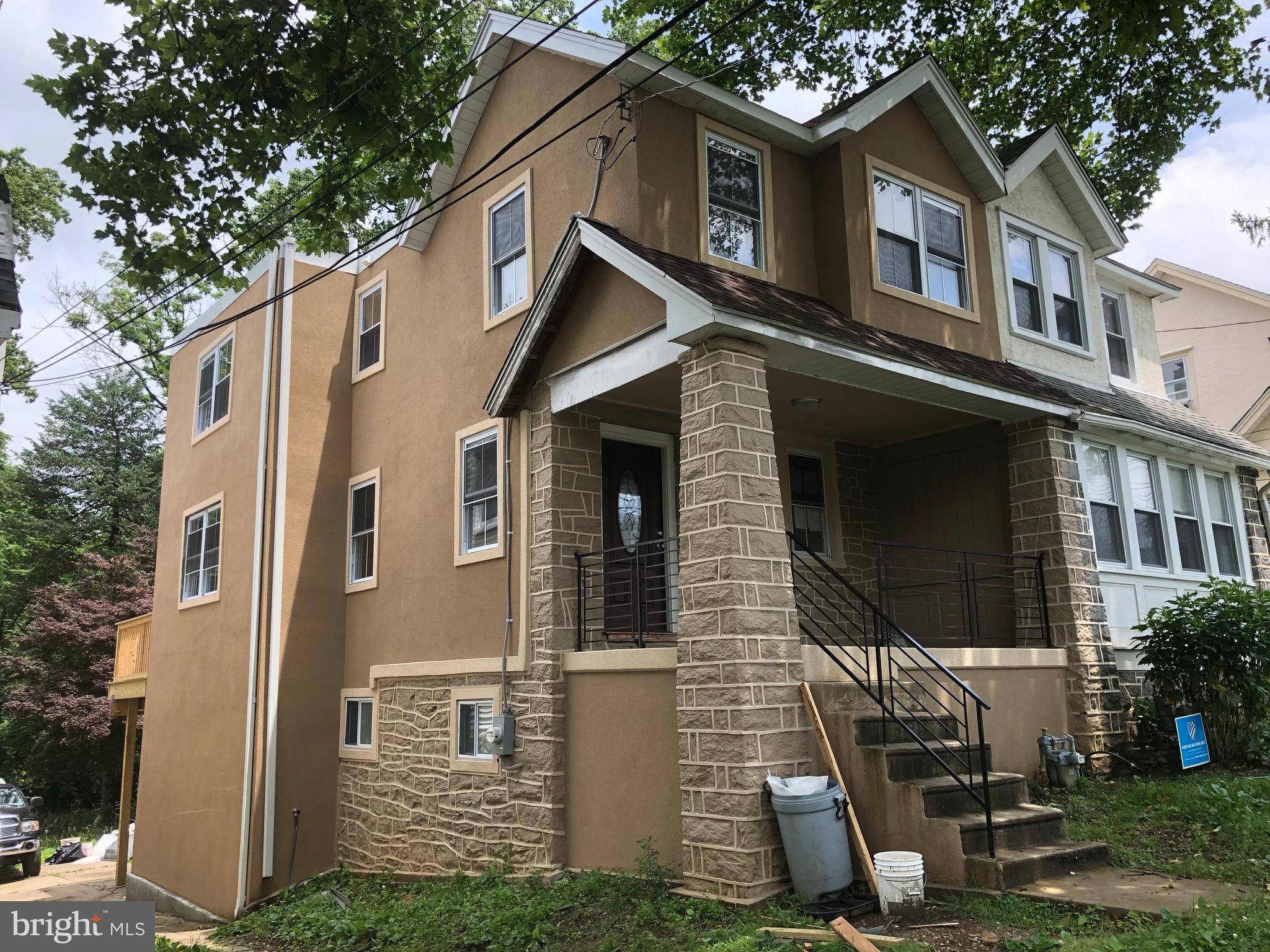 7703 Parkview Road Upper Darby, PA 19082 - Photo 1 of 30 a front view of a house with a garage