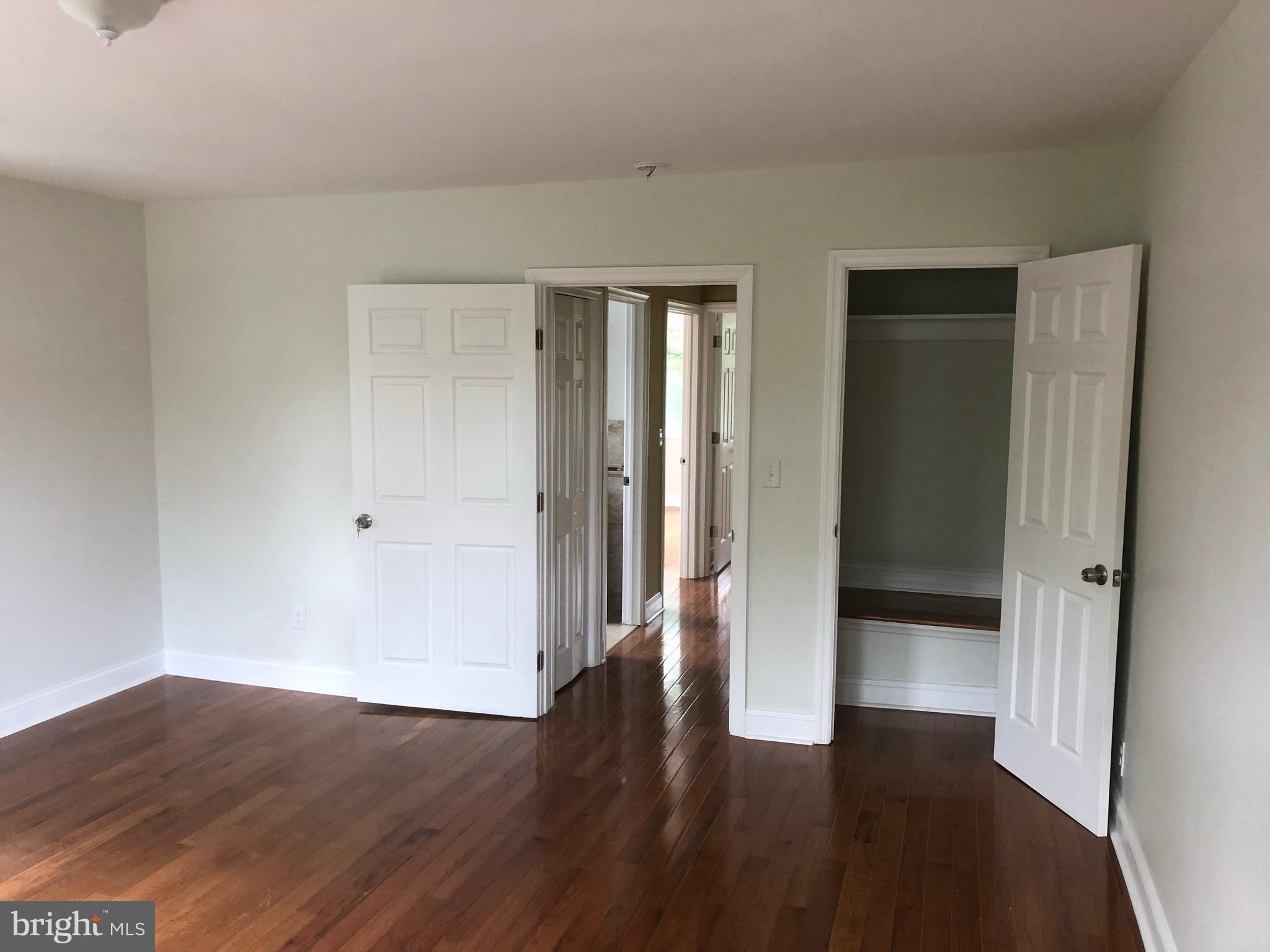 7703 Parkview Road Upper Darby, PA 19082 - Photo 21 of 30 a view of an empty room with wooden floor
