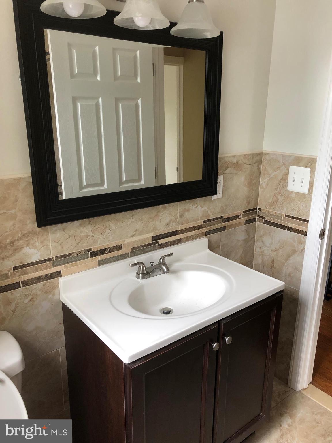 7703 Parkview Road Upper Darby, PA 19082 - Photo 24 of 30 a bathroom with a sink and a mirror