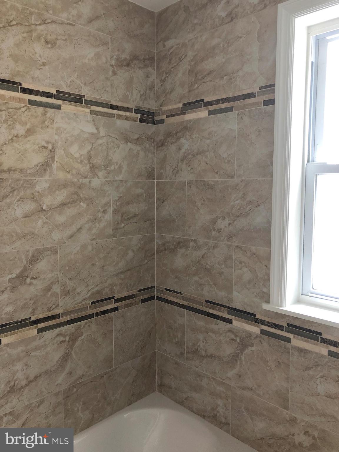 7703 Parkview Road Upper Darby, PA 19082 - Photo 26 of 30 a bathroom with a shower