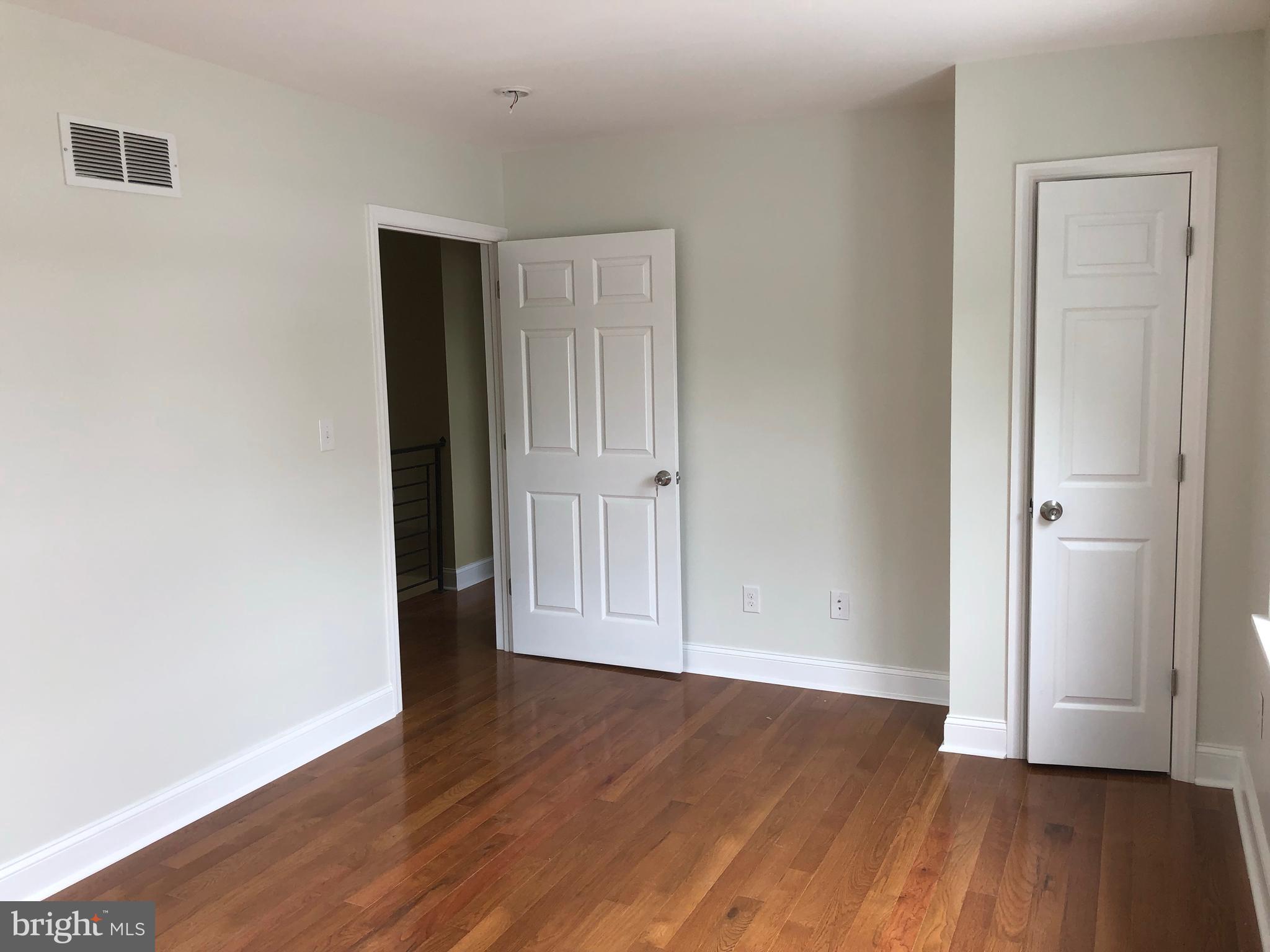 7703 Parkview Road Upper Darby, PA 19082 - Photo 27 of 30 an empty room with wooden floor and closet