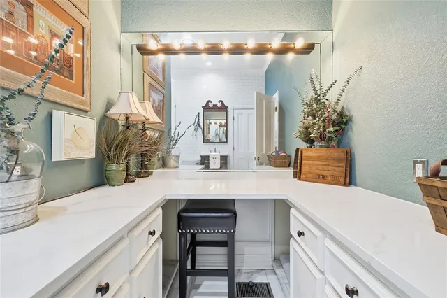 a bedroom with bed and a chandelier