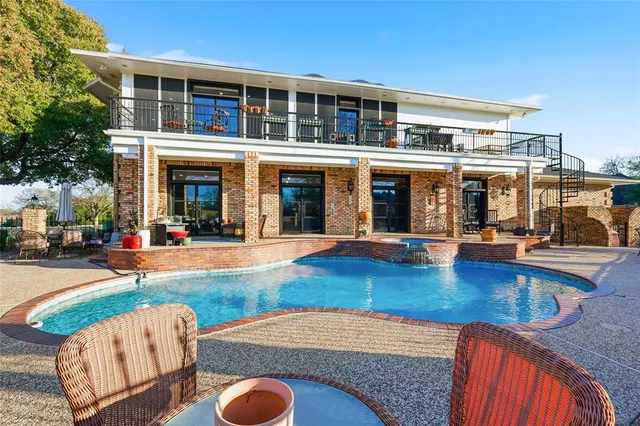 a view of a swimming pool with a lounge chairs
