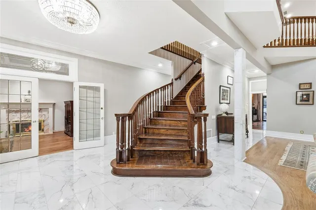 a view of entryway livingroom and hall with wooden floor