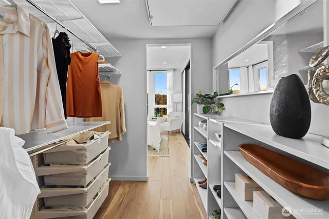 a bathroom with a sink shower and a mirror