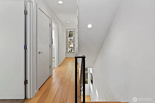 a living room with furniture a rug and a large window