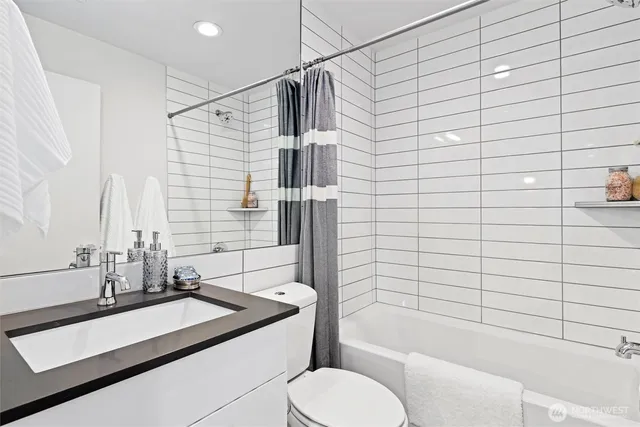 a terrace with outdoor seating and city view