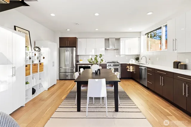 a view of a dining room with furniture window and wooden floor