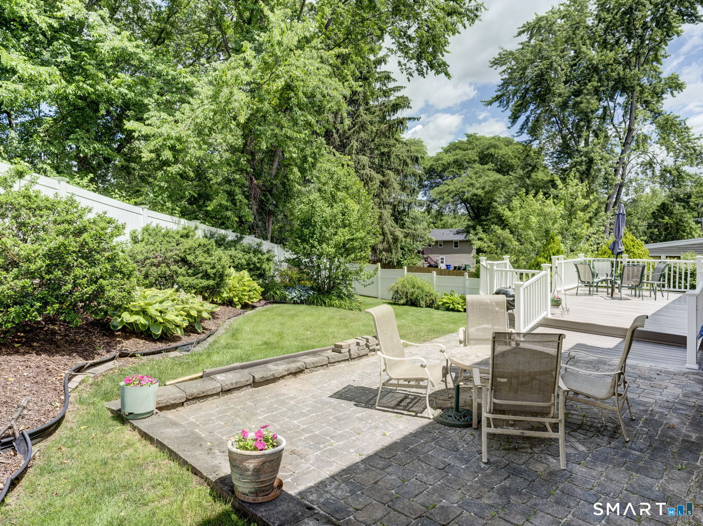 4 Lee Circle Bloomfield, CT 06002 - Photo 32 of 38 Stone patio and landscaped backyard
