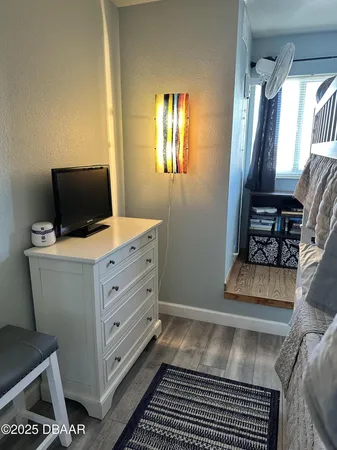 a view of room with window and furniture