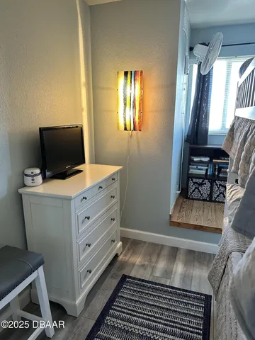 a view of room with window and furniture