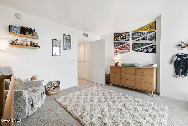 a bedroom with a bed and furniture