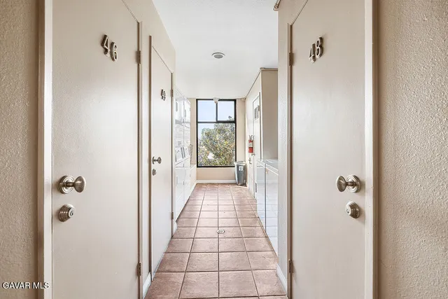 a view of a hallway with a shower