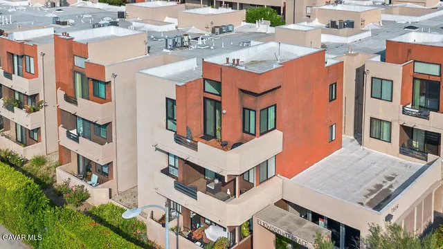 a view of a building with a clock tower in the middle
