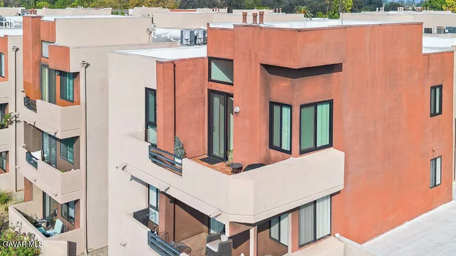 a view of balcony with a table and chairs