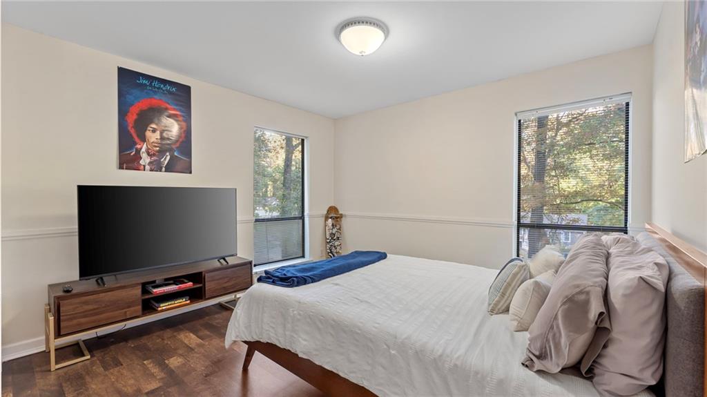 495 Ramsdale Drive Roswell, GA 30075 - Photo 17 of 32 a bedroom with a bed and a flat screen tv