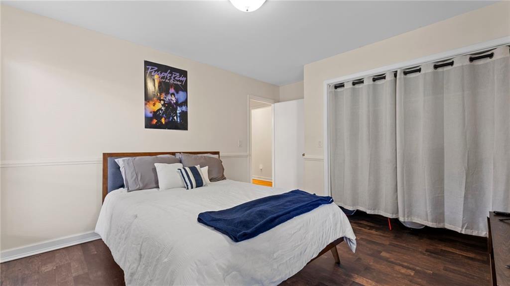 495 Ramsdale Drive Roswell, GA 30075 - Photo 18 of 32 a bedroom with a bed and a window