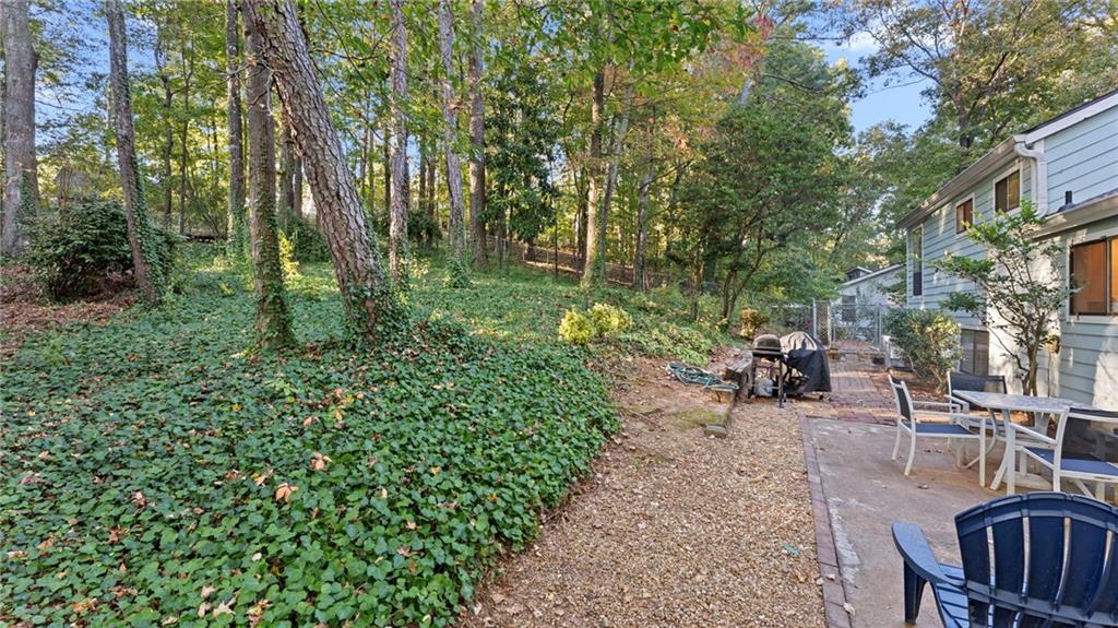 495 Ramsdale Drive Roswell, GA 30075 - Photo 23 of 32 a view of a backyard with plants and a patio