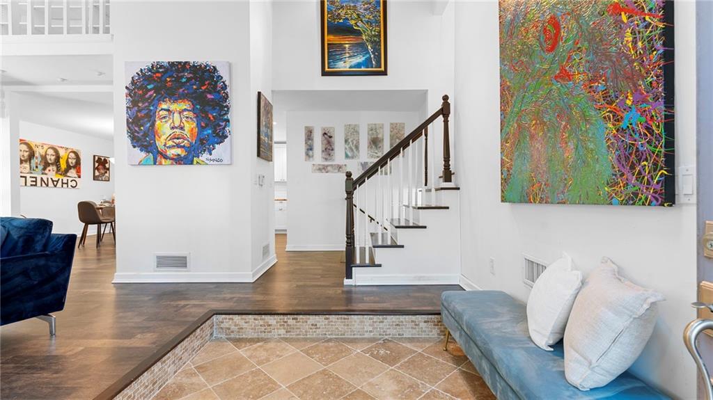 495 Ramsdale Drive Roswell, GA 30075 - Photo 4 of 32 a living room with furniture and a rug