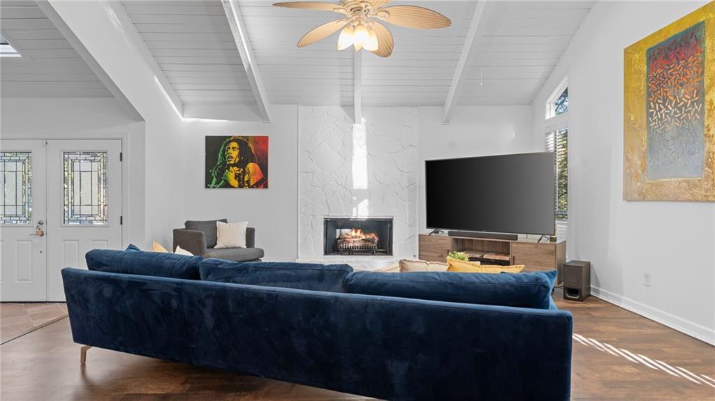 495 Ramsdale Drive Roswell, GA 30075 - Photo 6 of 32 a living room with furniture and a flat screen tv