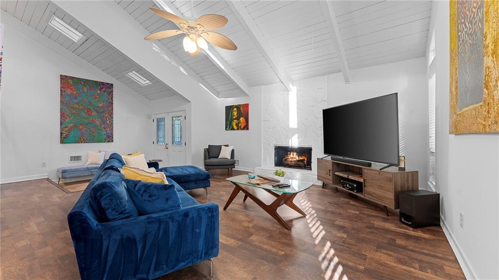 495 Ramsdale Drive Roswell, GA 30075 - Photo 7 of 32 a living room with furniture and a flat screen tv