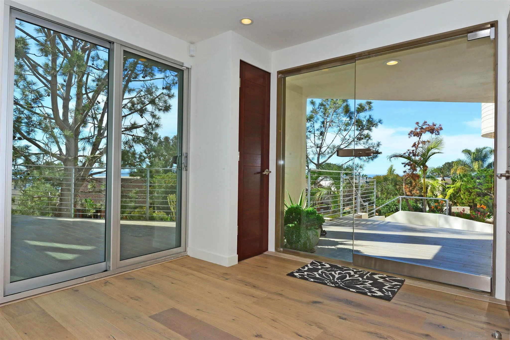 13721 Pine Needles Drive Del Mar, CA 92014 - Photo 6 of 32 a view of an entryway with garden