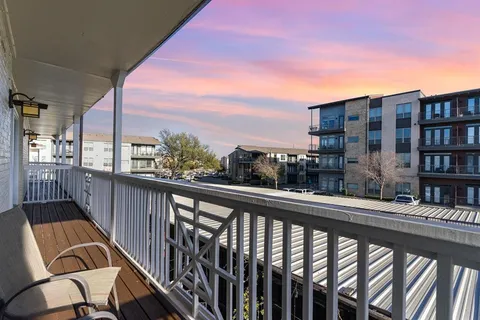 a view of a building from a balcony