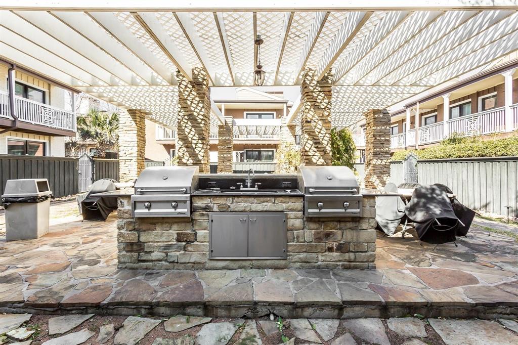 5934 Sandhurst Lane, Unit 207 Dallas, TX 75206 - Photo 20 of 31 View of patio / terrace with a pergola and an outdoor kitchen