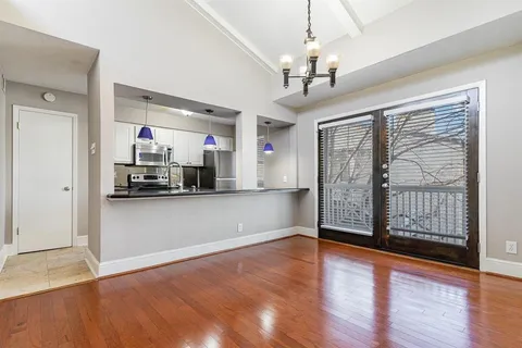 a view of a kitchen with a sink and cabinet area