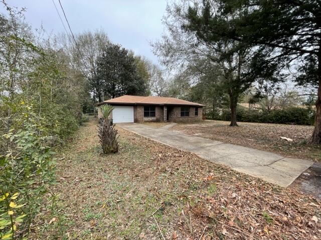 3071 Auburn Road Crestview, FL 32539 - Photo 2 of 21 a front view of a house with a yard
