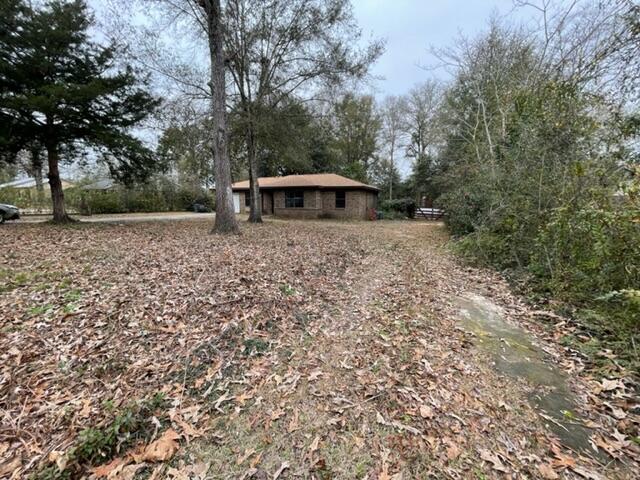 3071 Auburn Road Crestview, FL 32539 - Photo 3 of 21 a front view of a house with a yard