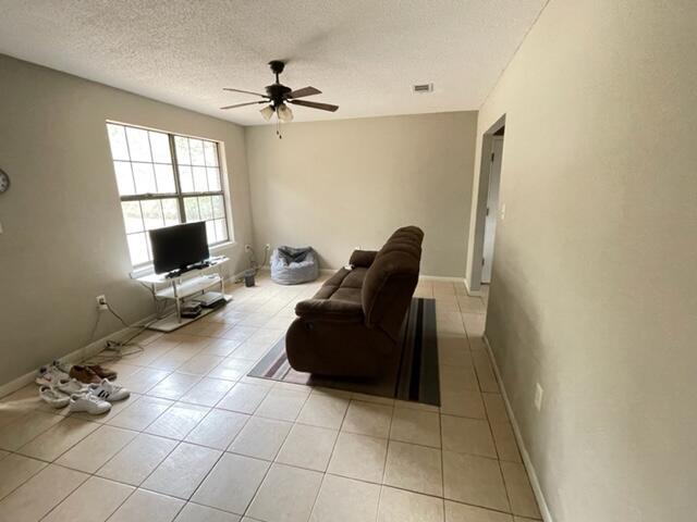 3071 Auburn Road Crestview, FL 32539 - Photo 7 of 21 a living room with furniture and a flat screen tv