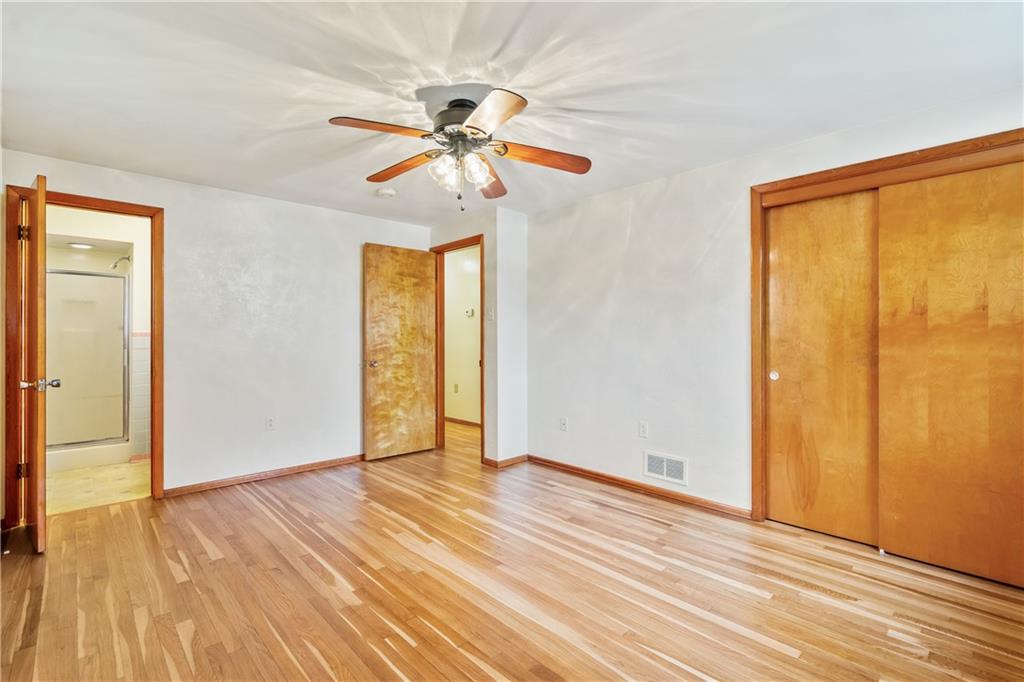 109 Marshall Drive Moon Township, PA 15108 - Photo 12 of 25 a view of empty room with wooden floor and fan