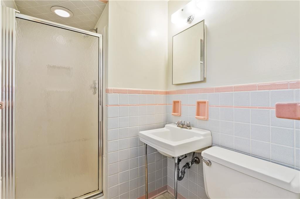 109 Marshall Drive Moon Township, PA 15108 - Photo 13 of 25 a bathroom with a sink a toilet and mirror