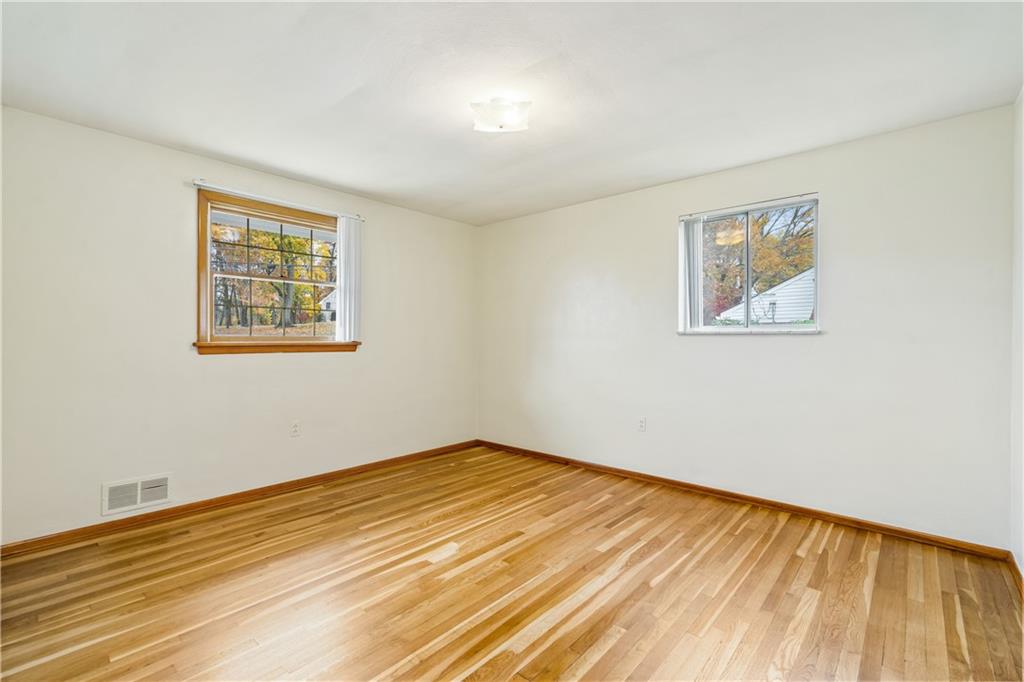 109 Marshall Drive Moon Township, PA 15108 - Photo 17 of 25 a view of an empty room with wooden floor and a window