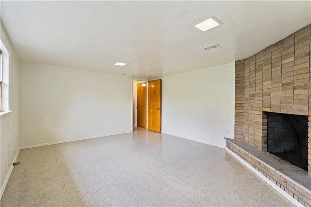 109 Marshall Drive Moon Township, PA 15108 - Photo 20 of 25 an empty room with a fireplace and window