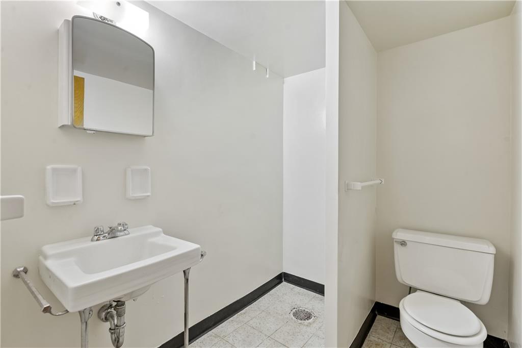 109 Marshall Drive Moon Township, PA 15108 - Photo 21 of 25 a bathroom with a sink toilet and mirror