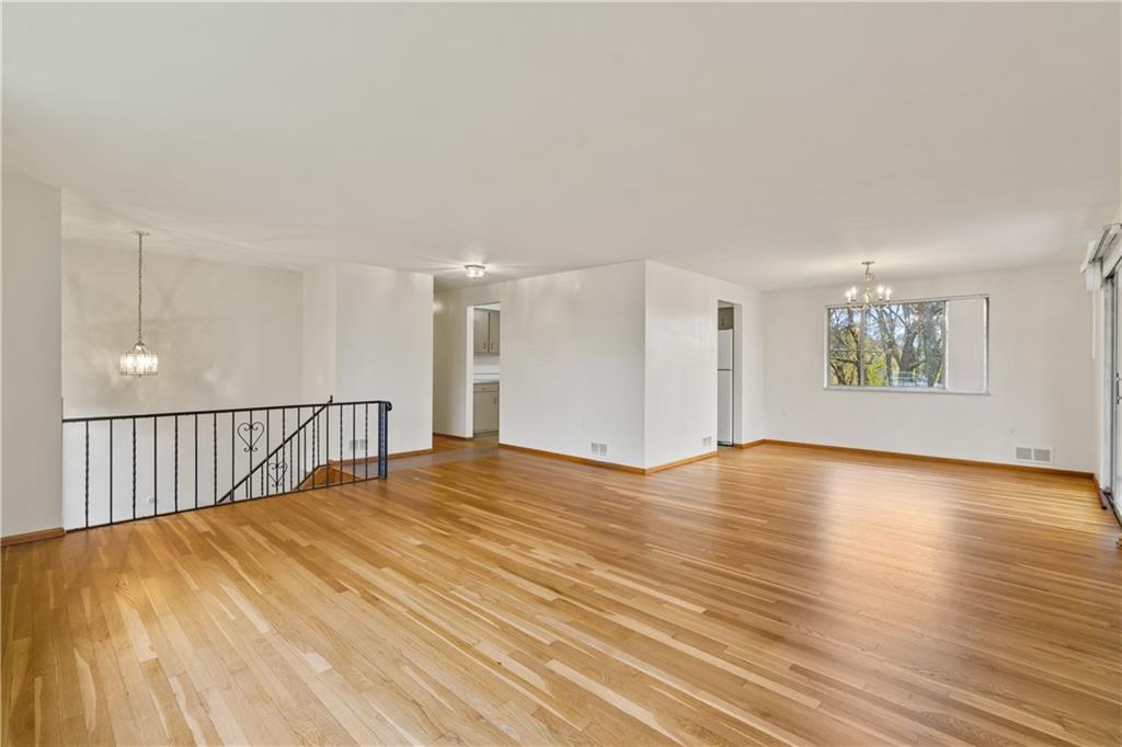 109 Marshall Drive Moon Township, PA 15108 - Photo 3 of 25 a view of an empty room with wooden floor and a window