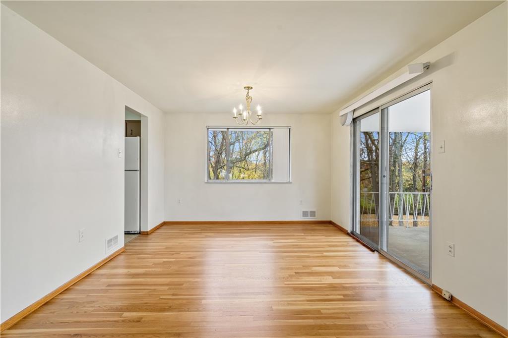 109 Marshall Drive Moon Township, PA 15108 - Photo 5 of 25 wooden floor in an empty room with a window