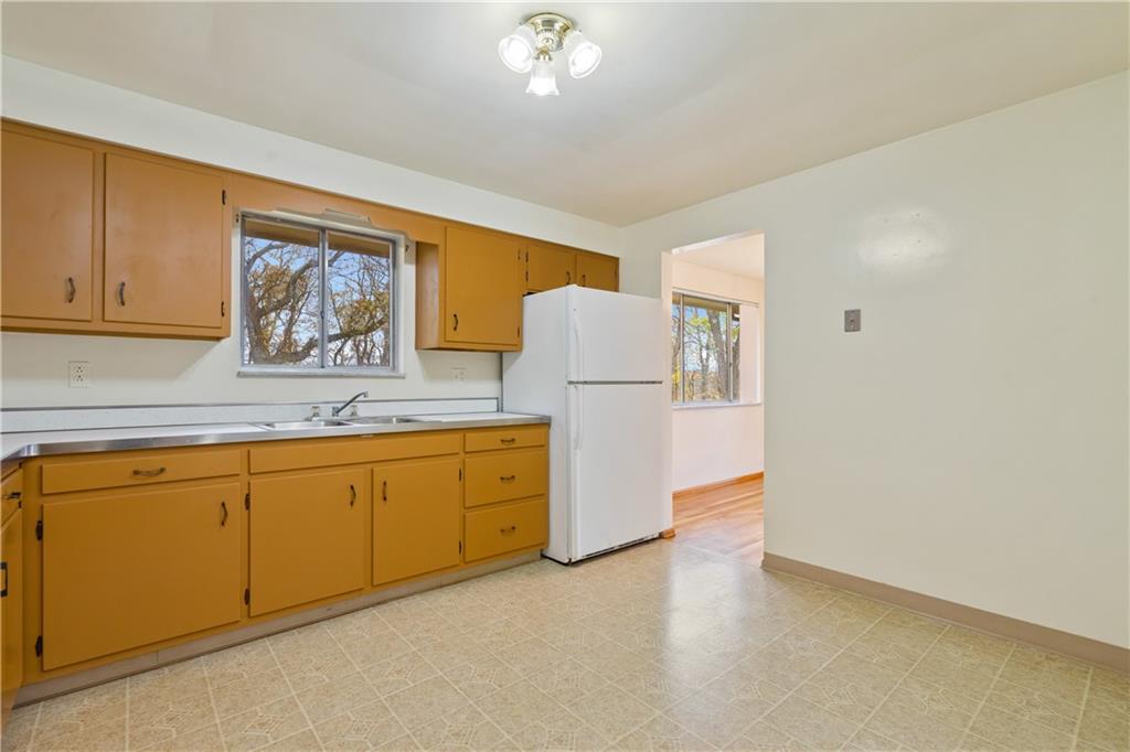 109 Marshall Drive Moon Township, PA 15108 - Photo 10 of 25 a kitchen with granite countertop cabinets and wooden floor