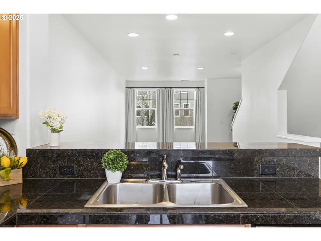 a kitchen with a sink and a refrigerator