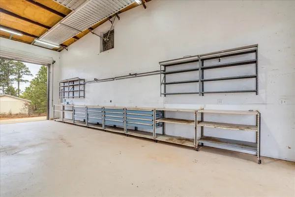 a view of an empty room with windows